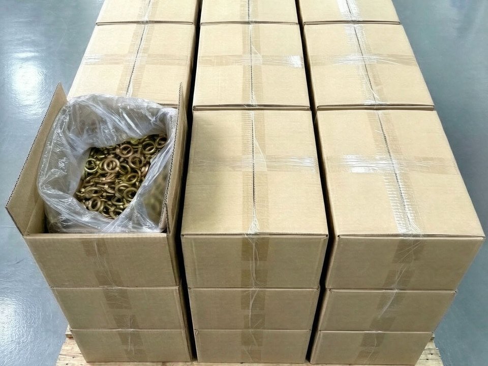 Cartons on a pallet, galvanized parts bagged inside