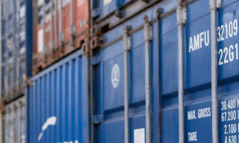 Container terminal, upper right: stacked shipping containers receding into the distance.
