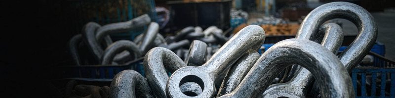Forged shackles in a production crate at the factory workshop